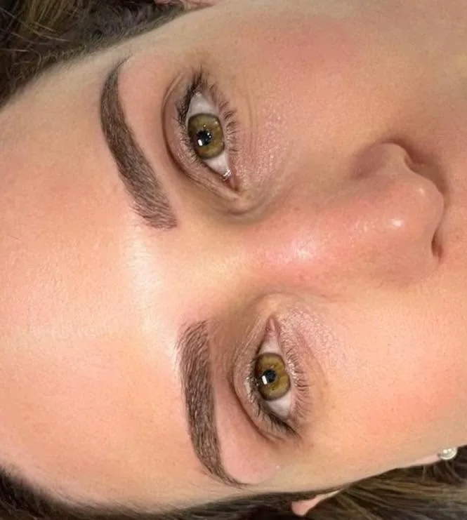 Sculpted brow tattoo result — rotated close macro